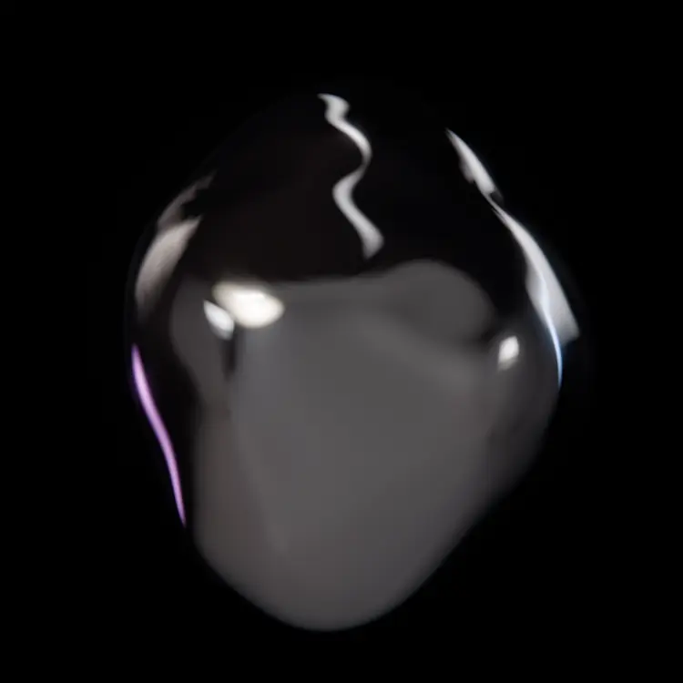 A chrome liquid-metal form suspended in darkness, its surface reflecting a single soft light.
